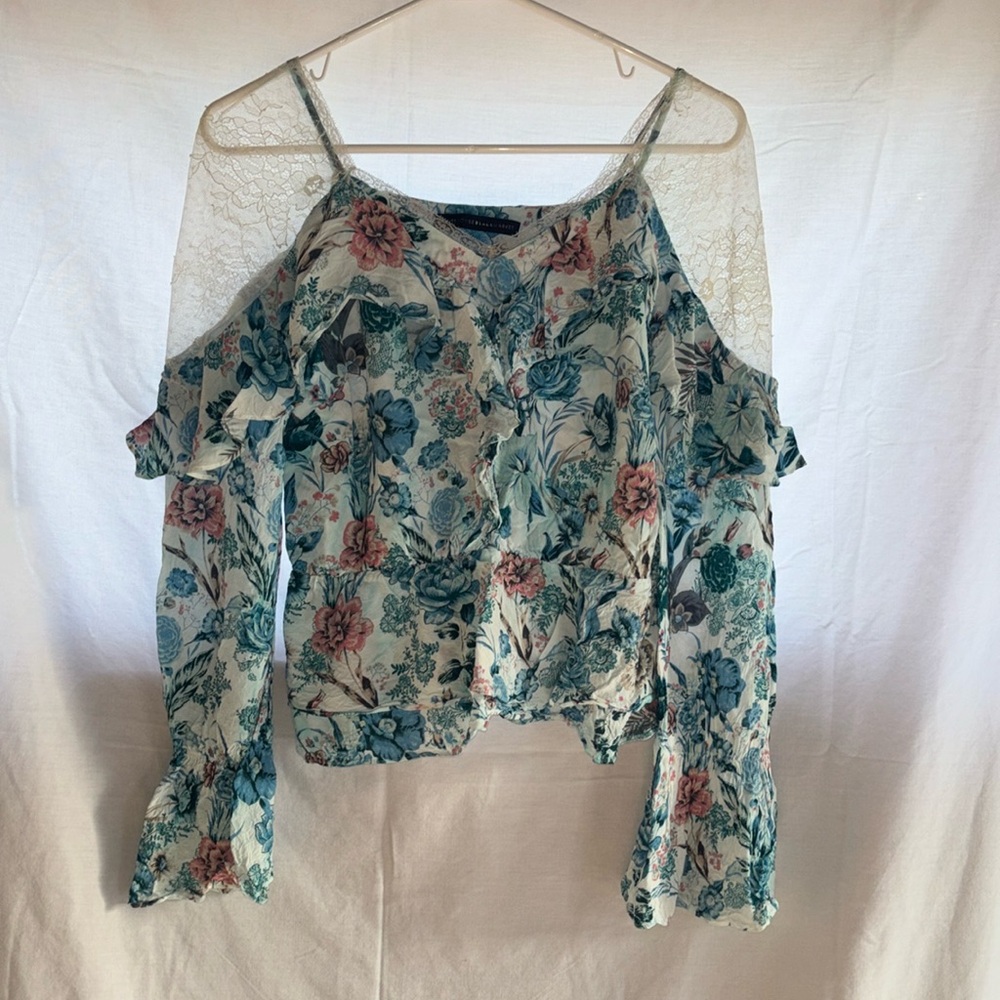 White House Black Market floral blouse with lace shoulders.